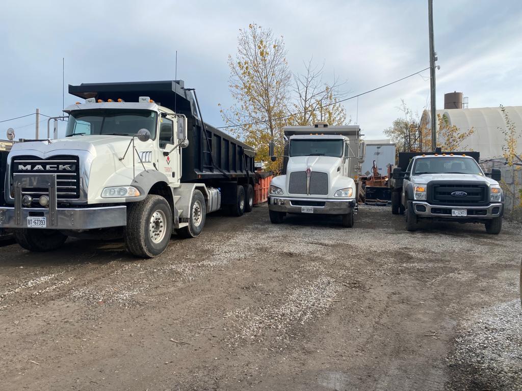 A bunch of trucks standing in line